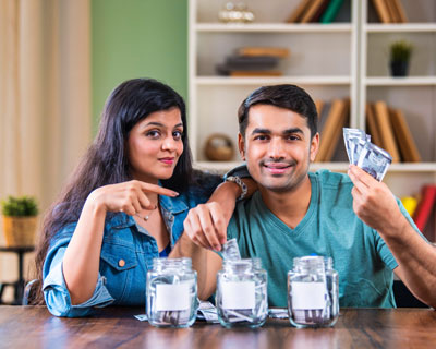 Couple With Money Jars